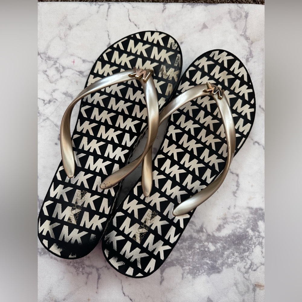 Michael Kors Logo flip flops with a platform heel